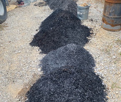 Finished biochar output from a WasteX mobile unit, staged for market
