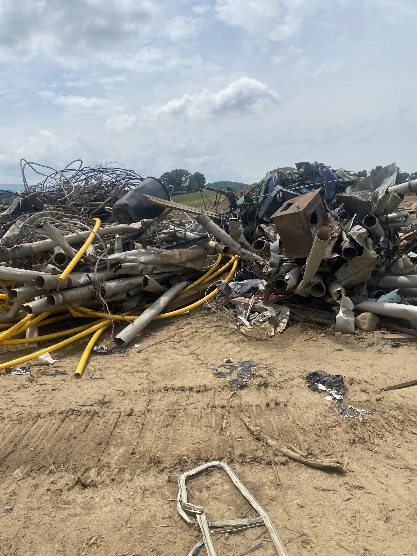 Mixed scrap metal, pipe and wire debris deposited by the floodwaters