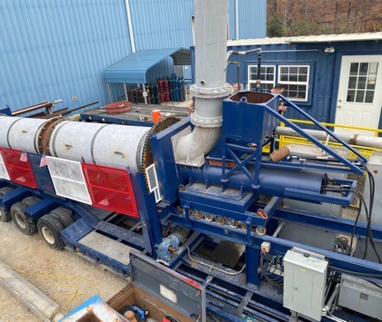 WasteX mobile gasification unit deployed on site, trailer-mounted with control trailer